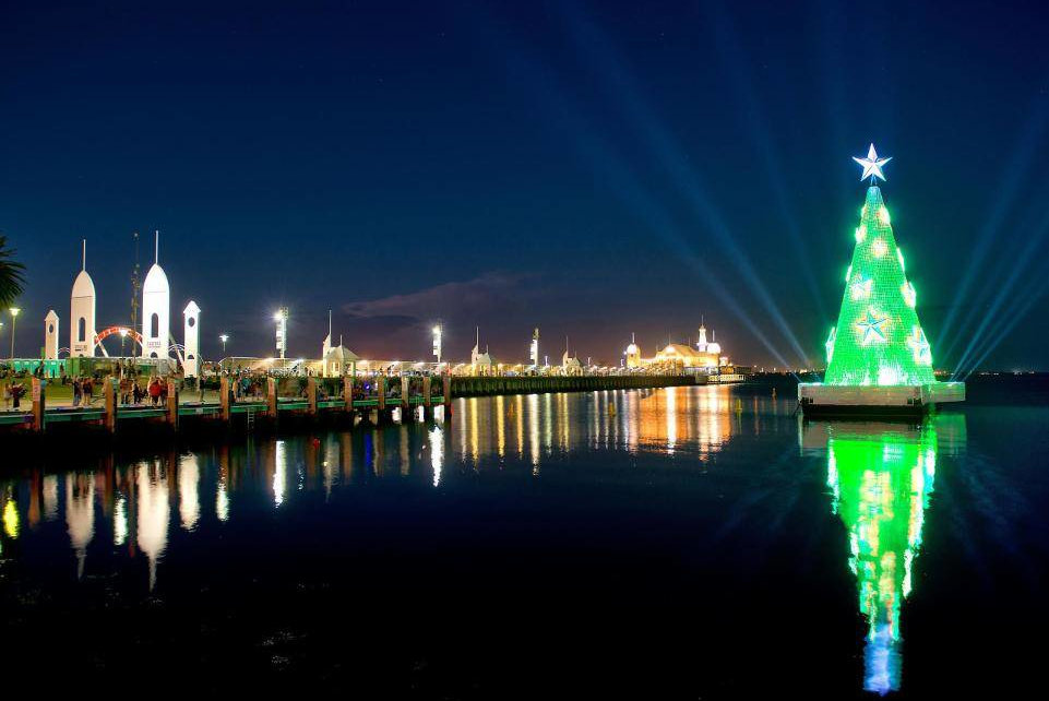 Large floating Christmas tree lit up at night in Geelong, engineering design by Vistek. Engineering art installations of this size is a specialised field.